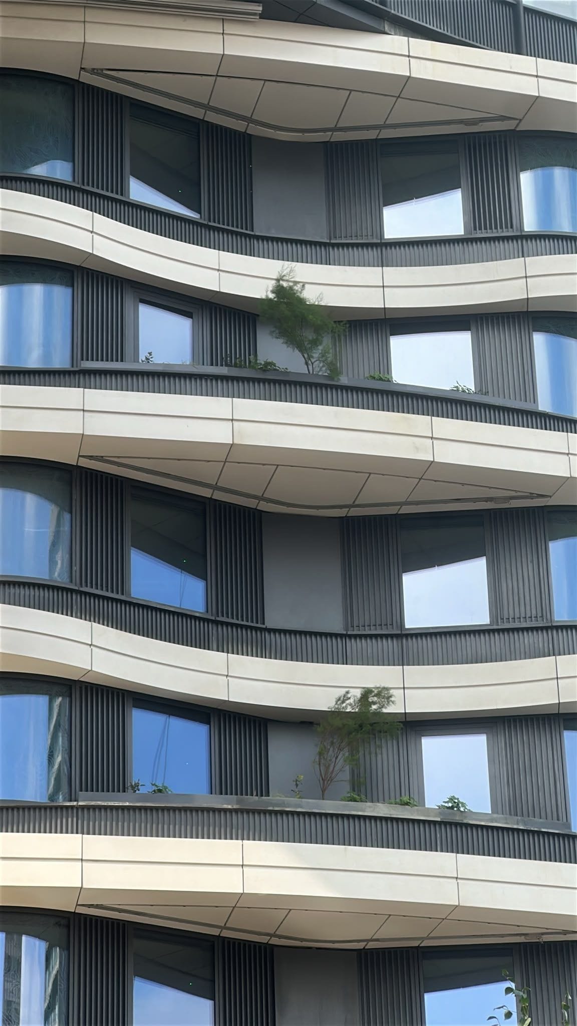 Building façade with planted terraces at several levels at 2 Trafalgar Way.